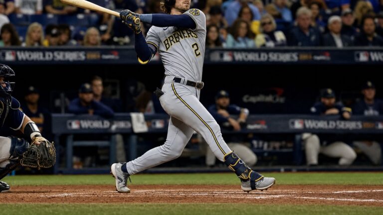 Brice Turang of the Milwaukee Brewers swinging at the plate during a World Series game at Tropicana Field