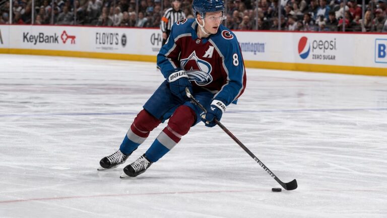 Cale Makar of the Colorado Avalanche skating with the puck in an NHL game