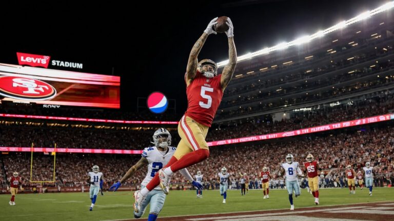 Mike Evans of the San Francisco 49ers leaping to make a catch at Levi's Stadium