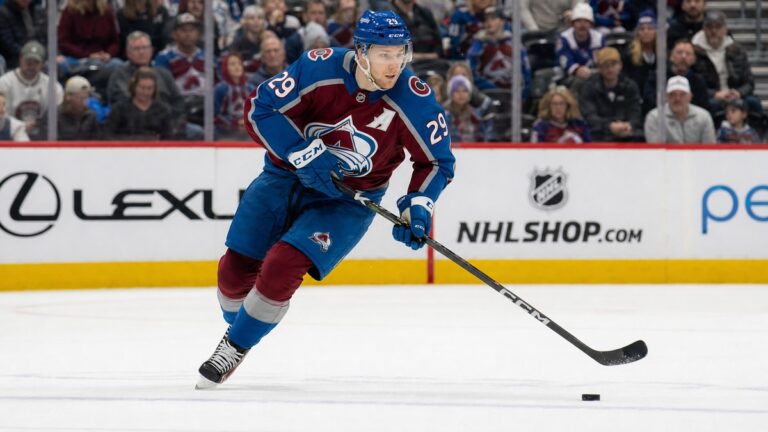 Nathan MacKinnon of the Colorado Avalanche skating with the puck in a number 29 jersey