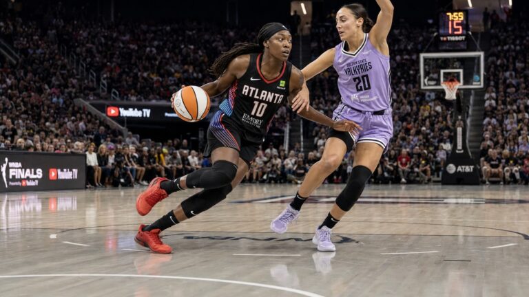 Rhyne Howard of the Atlanta Dream driving to the basket against the Golden State Valkyries in the WNBA Finals