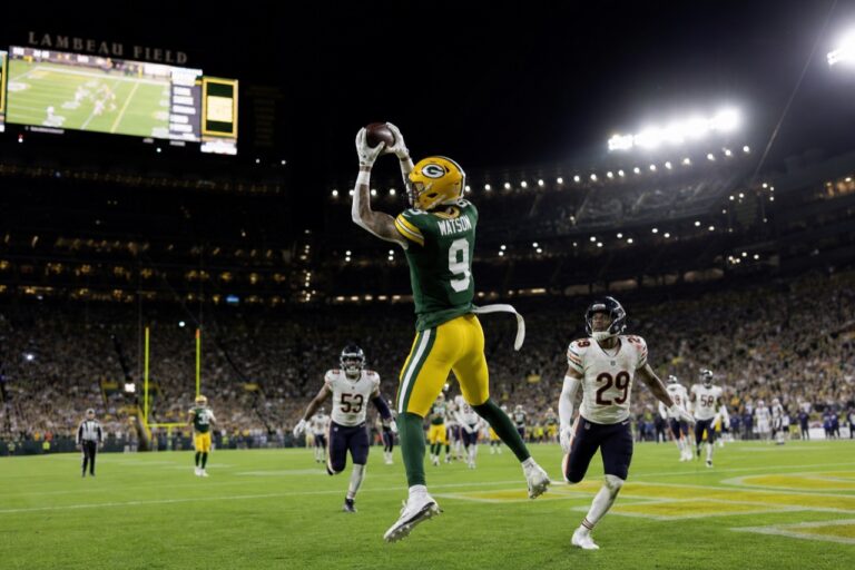 Christian Watson of the Green Bay Packers catching a pass at Lambeau Field
